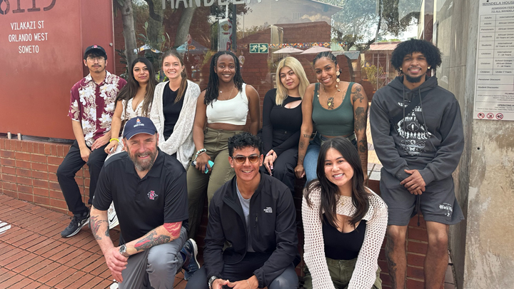 Dr. Paul Kaplan with SDSU Public Affairs Students in front of the Mandela House Museum in Soweto.