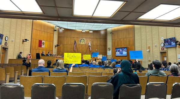 San Diego residents participate in a San Diego City Council meeting where funding for homelessness services is discussed.