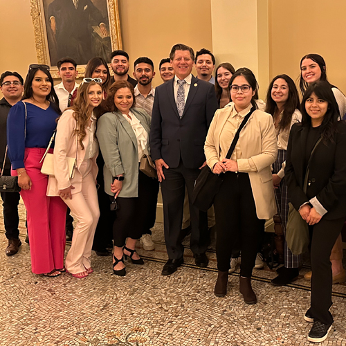 Public Affairs students posing at Capital building with politician