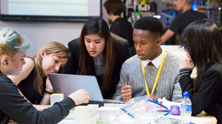 Students participate in a hands-on UrbanPlan simulation focused on urban development and community decision-making.